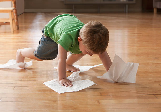 Kid cleaning floor | Signature Flooring, Inc