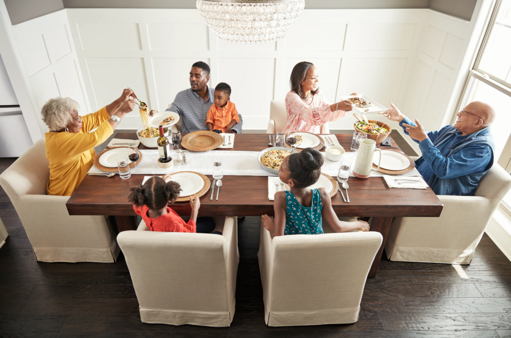 Family having breakfast at the dining table| Signature Flooring, Inc
